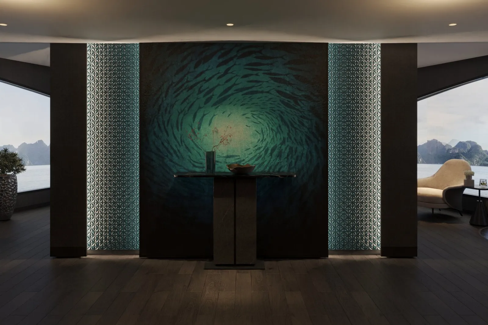 A dark-wood interior lounge with a backlit teal fish-school mural and a console table, flanked by large windows showing calm water and limestone karsts, with a cream armchair and a potted plant.